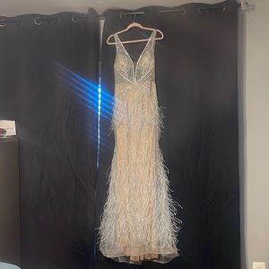 Its a cream dress with light bule feathers and silver rhinestones